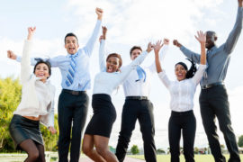 Successful business team Successful business team jumping and celebrating outdoors